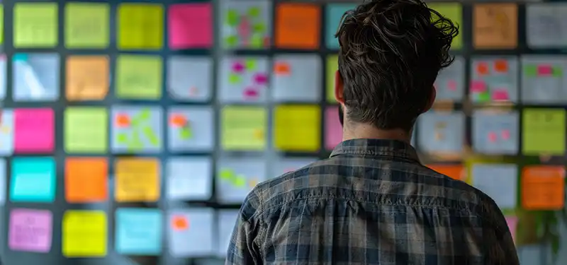 man looking at notes